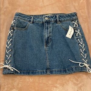 Denim mini skirt with lace up sides